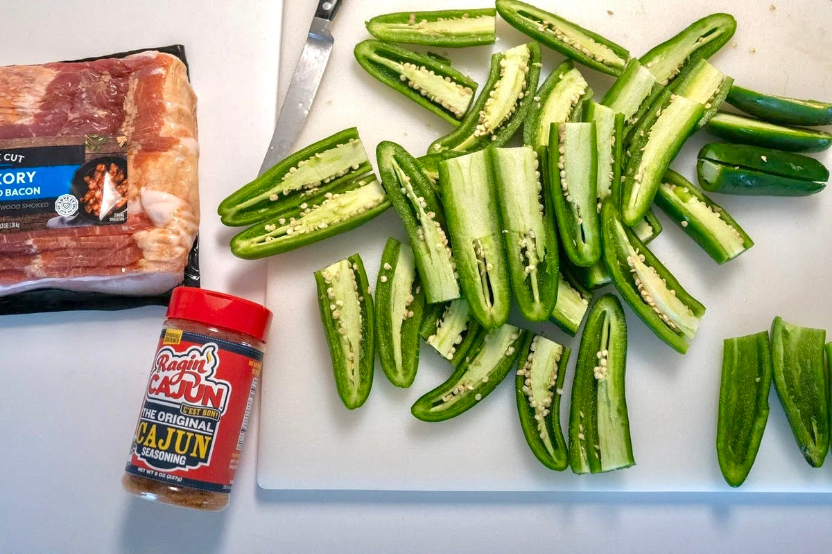 JalapeĂąos and Raginâ Cajun seasoning being prepared