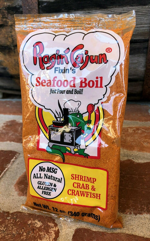 Packaging of Ragin' Cajun Seafood Boil mix on a wooden surface