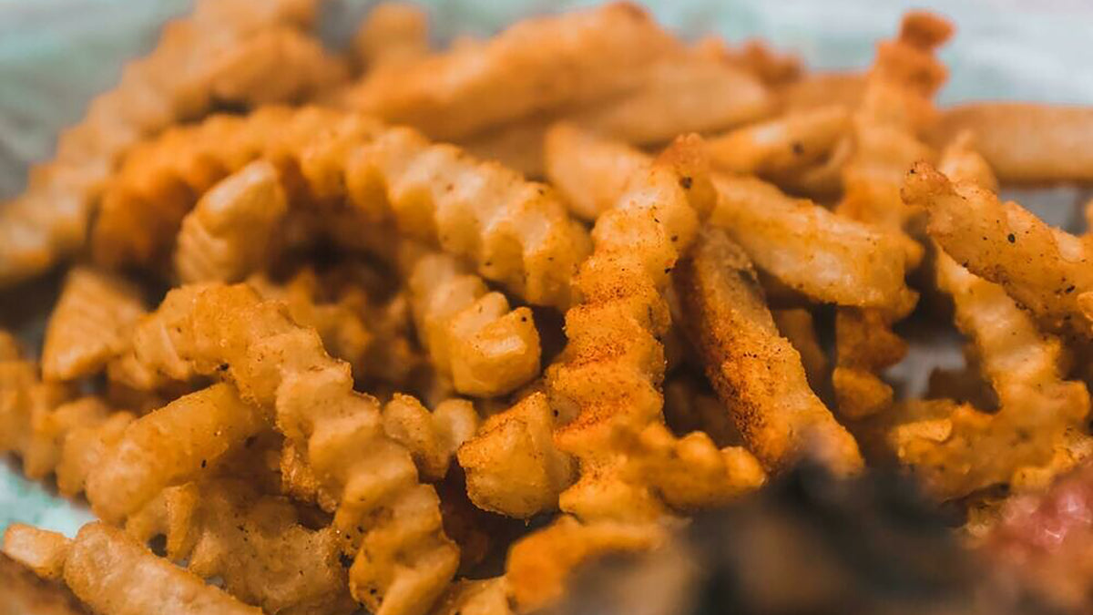 Basket of Cajun seasoned crinkle-cut fries