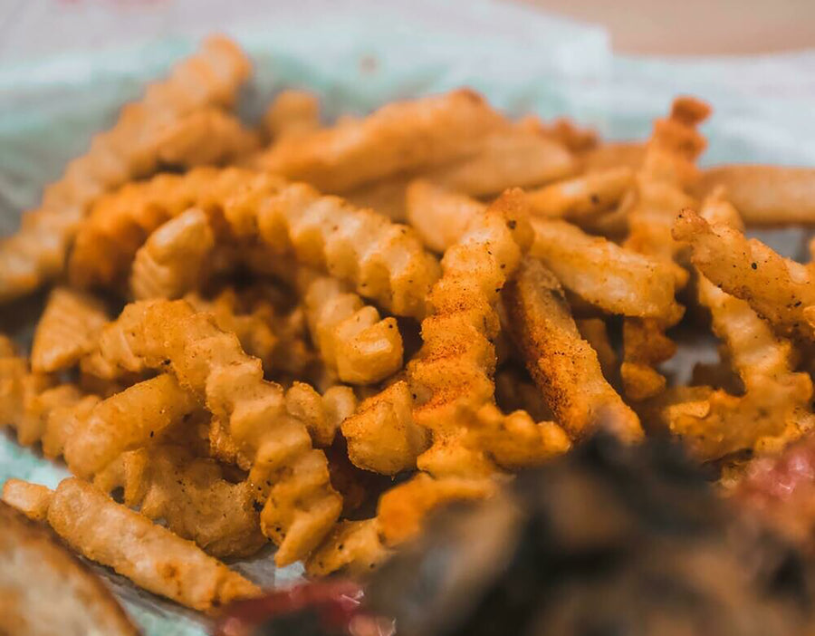 Basket of Cajun seasoned crinkle-cut fries