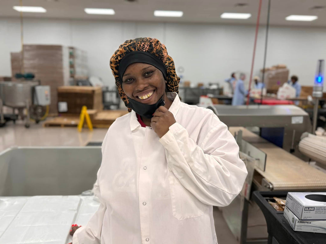 Acadian Kitchens production team member smiling in the facility