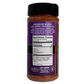 Product photography of an Acadian Kitchens Premium Blend spice jar with a vibrant purple label, displaying reddish-brown seasoning contents, zero calorie nutrition facts, and an Eat Fit logo from Broussard Louisiana