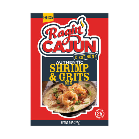 Product package design for Ragin' Cajun Authentic Shrimp & Grits Mix, featuring a prominent red and dark blue label, a vibrant red logo with a yellow flame, and an appetizing photo of prepared shrimp and grits garnished with green herbs and pepper, highlighting "Feeds 5" and "Ready in 25 minutes"