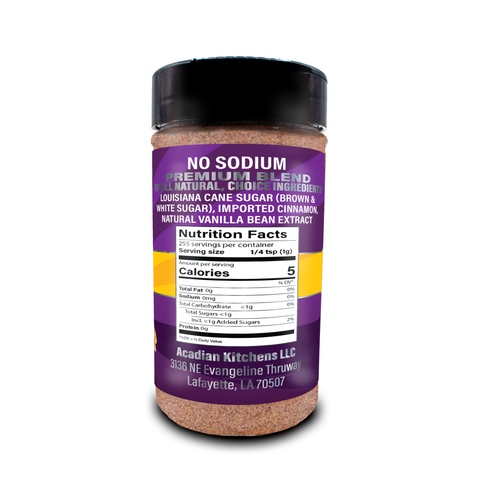 Product photography of Acadian Kitchens LLC No Sodium Premium Blend seasoning in a clear shaker bottle, with a vibrant purple and yellow label listing Louisiana cane sugar, imported cinnamon, natural vanilla bean extract, and 5 calories, from Lafayette LA