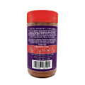 Photography of an Acadian Kitchens Cajun's Choice Premium Blend Creole Seasoning & Rub bottle on a white background featuring a vibrant red cap, dark purple label highlighting its lower sodium blend, and icons for perfect on seafood meat and fries