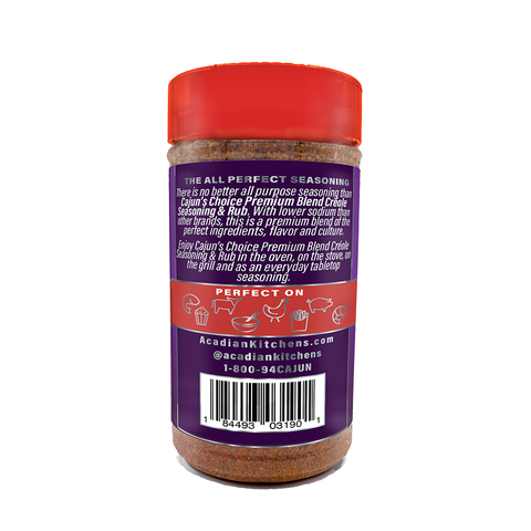 Photography of an Acadian Kitchens Cajun's Choice Premium Blend Creole Seasoning & Rub bottle on a white background featuring a vibrant red cap, dark purple label highlighting its lower sodium blend, and icons for perfect on seafood meat and fries