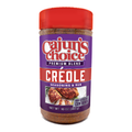 A clear plastic bottle of Cajun's Choice Premium Blend Creole Seasoning & Rub with a bright red cap a purple label showing savory seasoned chicken garnished with rosemary and mentioning New Resealable Container and Net Wt 10 OZ