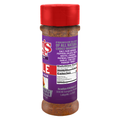 Digital photograph of a Cajun's Choice seasoning bottle on a white background, featuring a vibrant red flip-top cap, a distinctive purple label with "PREMIUM BLEND" text, and a visible brown-red spice blend from Lafayette Louisiana