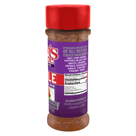 Digital photograph of a Cajun's Choice seasoning bottle on a white background, featuring a vibrant red flip-top cap, a distinctive purple label with "PREMIUM BLEND" text, and a visible brown-red spice blend from Lafayette Louisiana
