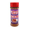 Product photography of a Cajun's Choice Premium Blend Creole Seasoning & Rub bottle, featuring a bright red cap, a vibrant purple label with bold red text, and an appetizing image of seasoned chicken breasts with rosemary and lime