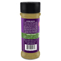 Product photograph of an Acadian Kitchens Premium Blend Creole Seasoning bottle featuring a vibrant purple and green label with a detailed gumbo recipe, whimsical food choice icons, a black shaker cap, and fine tan spice visible inside