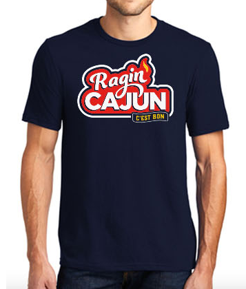 Navy blue t-shirt displaying a bold red and white "Ragin Cajun C'est Bon" graphic featuring a small orange flame and yellow accent text