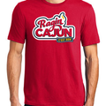Red t-shirt featuring the bold 'Ragin CAJUN' text in red, white, and blue outline, accented by a yellow flame and a blue banner with 'C'EST BON', representing University of Louisiana at Lafayette culture