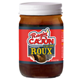 Product photography Ragin' Cajun Authentic Roux dark amber glass jar with a white lid, displaying a red and dark blue label highlighting "Ragin' Cajun C'est Bon!" and a wooden spoon image stirring roux