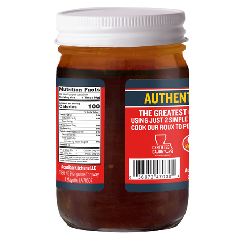 Acadian Kitchens Cajun roux in a clear glass jar with a white lid and prominent red and blue labels displaying Nutrition Facts, yellow AUTHENTIC text, and a Certified Cajun logo shaped like Louisiana, from Lafayette LA