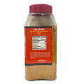 Product photo of an Acadian Kitchens LLC low sodium spice blend in a clear plastic bottle with a vibrant red cap and orange label detailing ingredients from Lafayette Louisiana with the granular yellow-brown seasoning visible