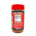 Product photography of an Acadian Kitchens Low Sodium seasoning bottle with a vibrant red cap and label, featuring bold white "LOW SODIUM" text on a dark blue banner, a visible reddish-brown spice blend, and a detailed Nutrition Facts panel from Lafayette LA