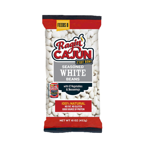 Product photography of a Ragin' Cajun Seasoned White Beans bag in clear plastic packaging featuring a distinctive red and white brand logo, a yellow 'Feeds 8' badge, and a prominent red banner stating '100% Natural, No Fat, No Gluten'