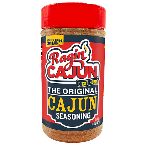 Product photo of a Ragin' Cajun Seasoning clear jar featuring a bright red resealable cap, a bold red and dark blue label with "Ragin' Cajun C'est Bon!" and "New Resealable Container" text, and the visible reddish-brown spice blend inside