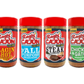 Product Photography of a line of six Cajun seasoning bottles on a white background featuring five Ragin' Cajun red label varieties including Original, Ragin' Hot with flames, Y'all Purpose, Sizzlin' Steak, and Chicken & Gator with an alligator chef, alongside one Cajun's Choice Blackened seasoning with a purple label