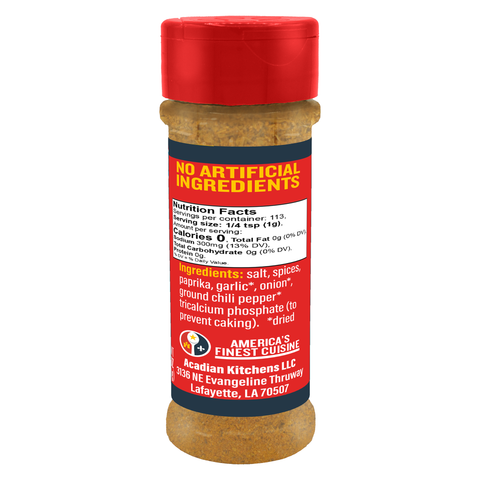 Product photography of an Acadian Kitchens America's Finest Cuisine seasoning bottle from Lafayette, LA, showcasing its bright red cap and label, visible gold-brown spice blend, and text 'NO ARTIFICIAL INGREDIENTS' along with listed ingredients like paprika and ground chili pepper