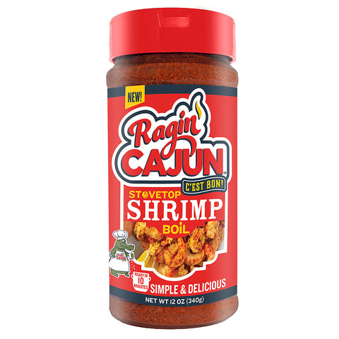 Product photo of Ragin' Cajun Stovetop Shrimp Boil seasoning in a clear bottle with a bold red label, prominently featuring a cartoon alligator chef, the Ragin' Cajun logo with a flame, and an appetizing image of seasoned shrimp skewers with lemon wedges